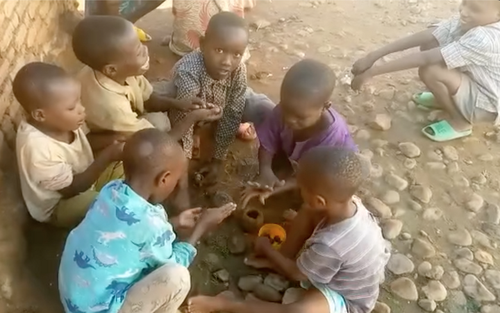 Children making some clay pots Children making some clay pots
